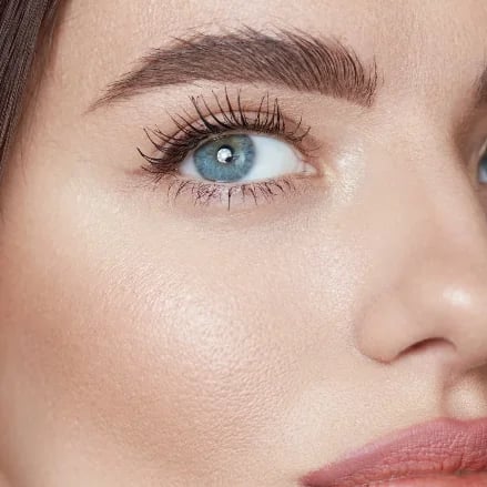 Well-defined, gently lifted brows framing bright, refreshed eyes