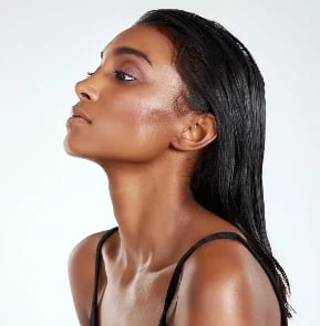Side profile showing a defined chin and neck line