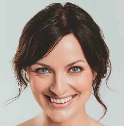 Smiling woman with a refreshed, natural facelift result