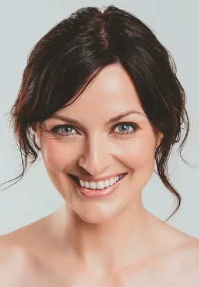 Smiling woman with dark hair, front view of a soft, balanced lower face