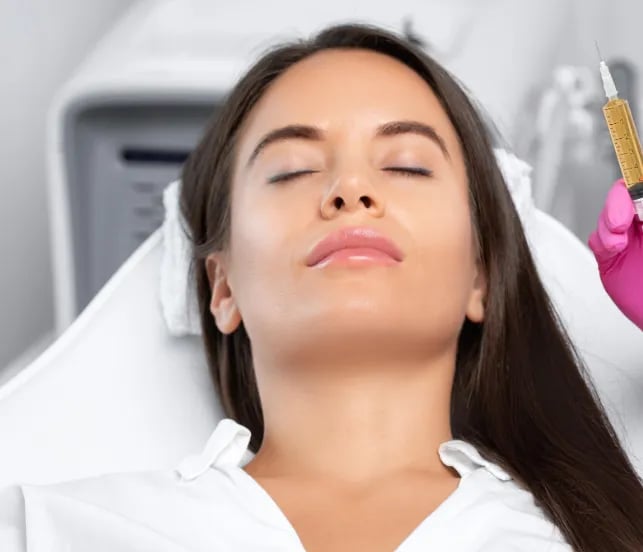 Patient resting in a treatment chair during an in-office procedure
