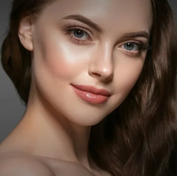 Close portrait of a woman with smooth, natural looking facial contours